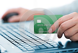 Man holding green payment card