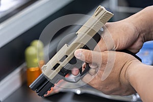 Man holding gun aiming pistol in hand ready to shoot