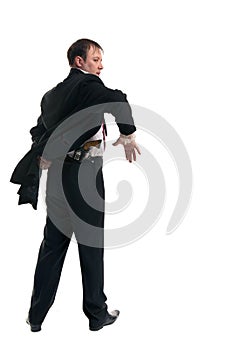 Man holding a gun behind his back