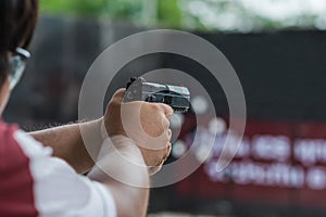 Man holding gun ready to shoot for protect and security