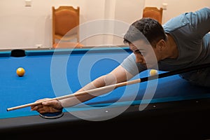 man holding hand on pool table, playing snooker or getting ready to shoot billiard balls, snooker billiards port game, billiard