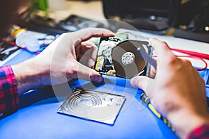 Man holding a hard disc