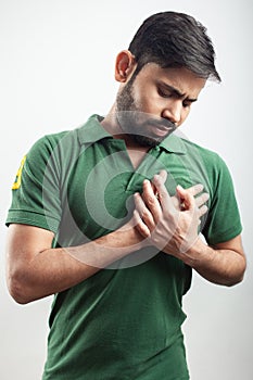 Man holding his chest pain zone due to acidity