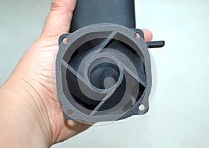 Man holding in his hand model that printed on 3D printer. Creating of model on industrial 3D printer