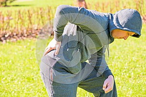 Man holding his hand sore back photo