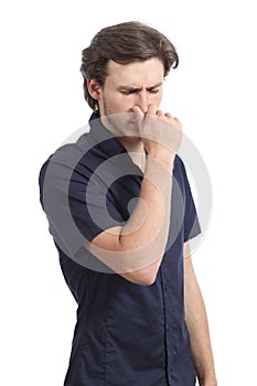 Man holding his nose smelling stink