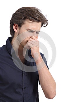 Man holding his nose because of the stink photo