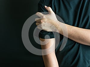 Man holding his painful arm, healthcare and ache in human body
