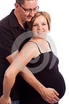 Man holding his pregnant wife's belly