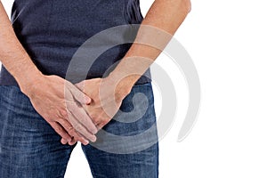 Man holding his urethra in pain. Men problems on white background. Medical concept