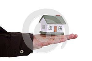 Man holding a house in his hand