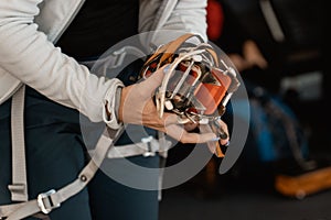 Man holding the ice climbing crampons