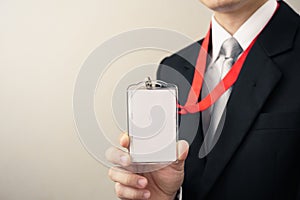 Man holding Identification card.