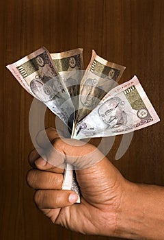 Man holding indian money