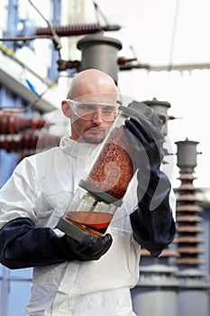 Man holding industrial tube