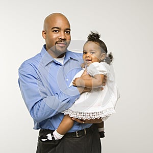 Man holding infant girl.