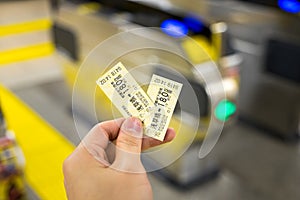 man holding japan train tickets