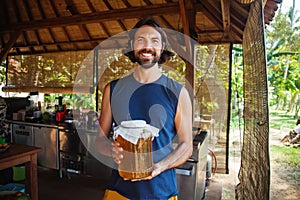 Man holding a jar of honey