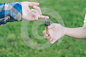 Man holding a key from the new home in hands