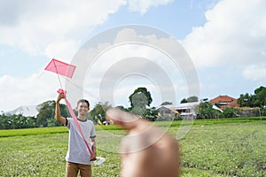 A man holding a kite