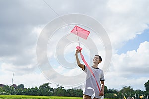 A man holding a kite