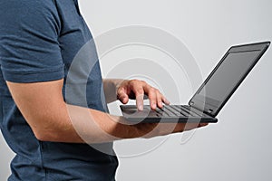 Man holding laptop to diagnose problem