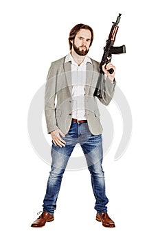 Man holding a machine gun isolated on white background