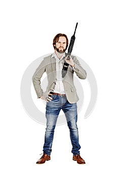 Man holding a machine gun isolated on white background