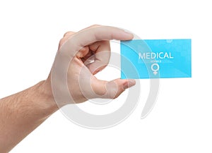 Man holding medical business card on white, closeup. Women`s health service