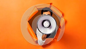Man Holding Megaphone Through Hole in Orange Paper with Copy Space - Generative Ai