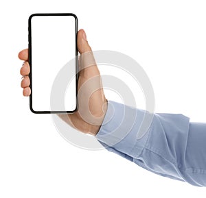 Man holding mobile phone with empty screen on background, closeup