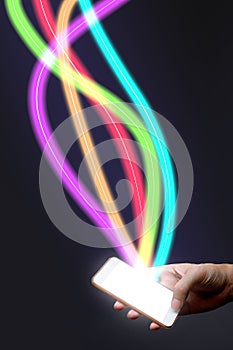 Man holding mobile phone and fiber optical light network.