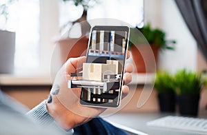 Man Holding Mobile Phone With Open App for Online Shopping and Delivery Directly From Warehouse or Factory. 3d Rendering