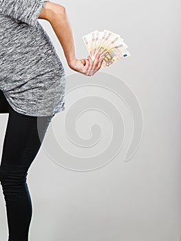 Man holding money behind his back