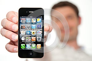 Man Holding a New iPhone 4