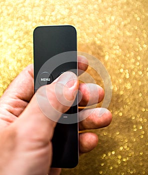 Man holding new modern tiny thin remote control