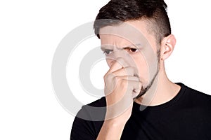 Man holding nose against bad smell.