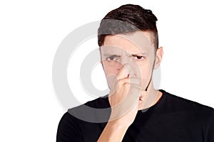 Man holding nose against bad smell.