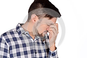 Man holding nose against bad smell.