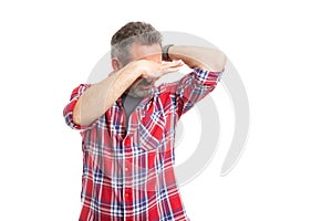 Man holding nose as smelling armpit