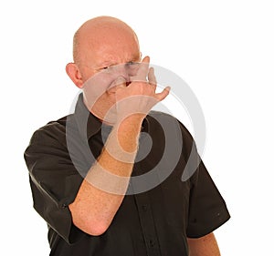 Man holding nose for smell