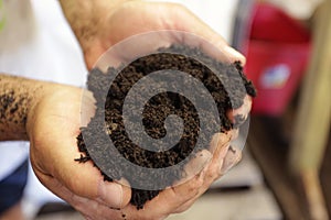 Man Holding Nutrient Rich Potting Soil photo