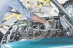 Man holding oil gauge level