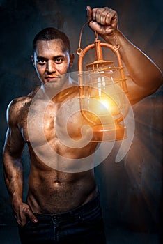 Man holding oil lamp