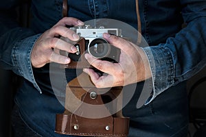 Man holding an old film camera camera