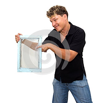 Man holding an old window