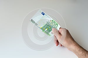 Man holding one hundred Euro banknote