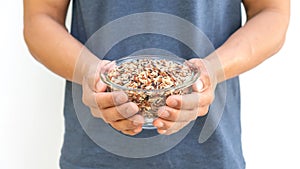 Man holding organic three colors (red, black, and brown) rice on a white background