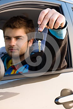 Man holding out car keys