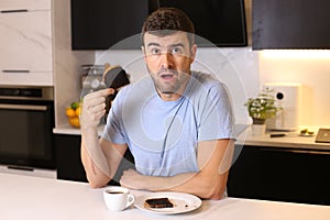 Man holding overdone toasted bread